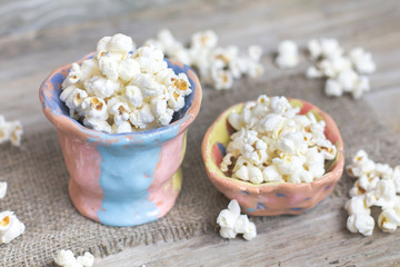 Homemade Kettle Corn Popcorn in unusual pottery pot on vintage w
