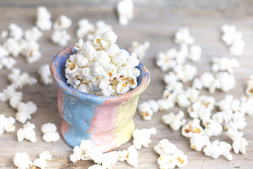 Homemade Kettle Corn Popcorn in unusual pottery pot on vintage w