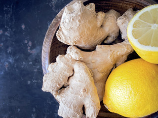 Ginger and lemon on dark vintage background