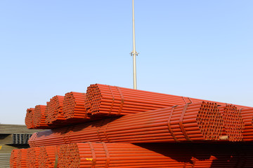 Many steel pipes stacked together