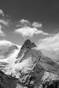 Fototapeta Black and white view on high winter mountains in snow