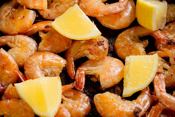 Fresh grilled shrimps with lemon close up