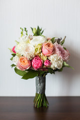 Wedding bouquet on a wooden surface