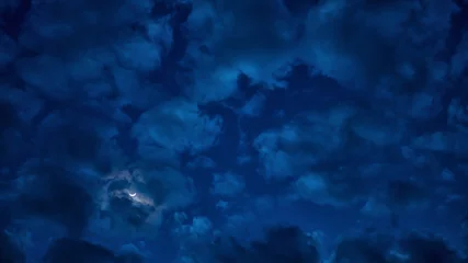  Cloudy and moon in the night sky. © panya168