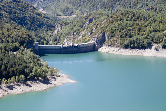 Bubal's dam surrounded of pine trees and water in Pyrenees, Spain