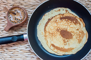 Stack of pancakes on a frying pan. Top view.