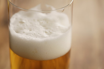 macro shot of lager beer in a glass with copy space