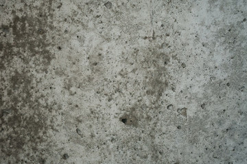 rough grey grungy concrete background, focus in the middle of frame