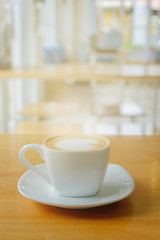 Hot coffee on table.