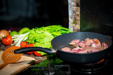 in a frying pan fried meat
