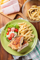 Cutlet Cordon Bleu with pork loin served with French fries and s