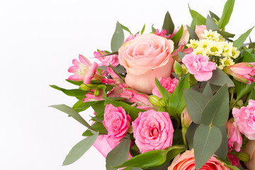 Bright buketny composition from fresh flowers, the white isolated background