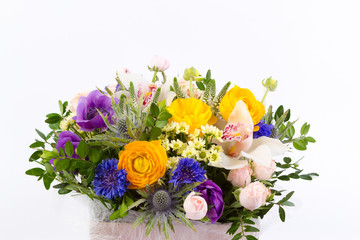 Obraz premium Bright buketny composition from fresh flowers, the white isolated background