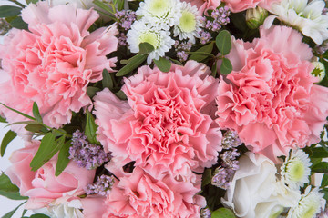 Bright buketny composition from fresh flowers, the white isolated background