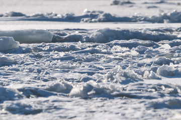 Fototapeta na wymiar Frozen sea view on sunny day.