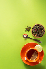 Obraz na płótnie Canvas cup of tea at light green paper