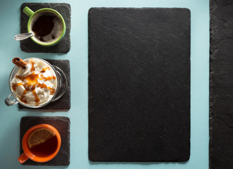 cup of coffee, tea and frappe at paper background