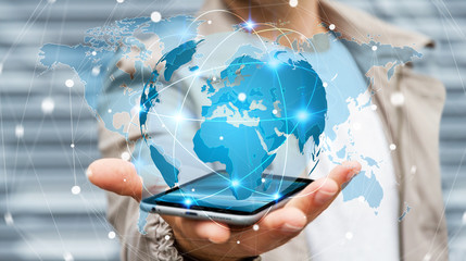 Businessman holding global network on planet earth 3D rendering