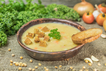 Fresh Vegetarian or vegan yellow split pea soup with parsley, on