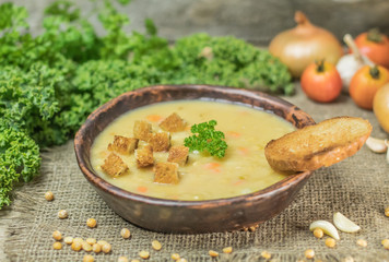 Fresh Vegetarian or vegan yellow split pea soup with parsley, on