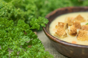 Fresh Vegetarian or vegan yellow split pea soup with parsley, on