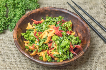 Fresh healthy raw nutritional salad with organic curly kale gree