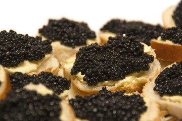 Group of snacks with black caviar