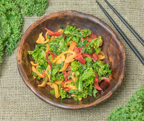 Fresh healthy raw nutritional salad with organic curly kale gree