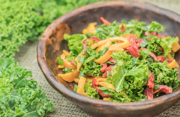 Fresh healthy raw nutritional salad with organic curly kale gree