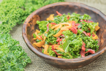 Fresh healthy raw nutritional salad with organic curly kale gree