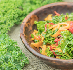 Fresh healthy raw nutritional salad with organic curly kale gree