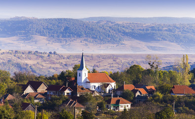 rural landscape with church in Transylvania, Romania