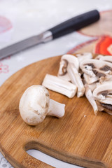 Sliced and chopped mushrooms on the cutting board