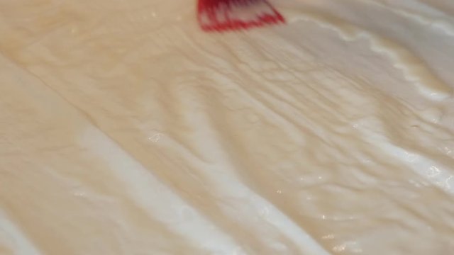 Spreading vegetable oil and eggs mixture over phyllo thin sheets of dough 4K 2160p 30fps UHD footage - Homemade filo pie with cheese and spinach 3840X2160 UltraHD video