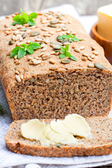 Homemade  sliced rye bread with sunflower seeds and fresh butter
