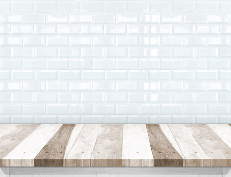 Empty wood plank table top with glossy ceramic white tile wall,M