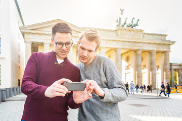 Two men looking at a smartphone in Berlin