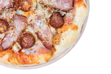 Flat lay overview of pizza with domestic ham sirloin and sausage