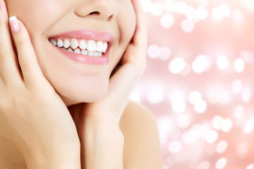 Happy woman smiling on an abstract background with blurred light