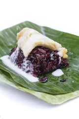 Thai custard sticky black rice dessert on banana leaf