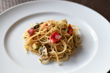 pasta salad with spaghetti, pepper, mozzarella, red onion, pine nuts