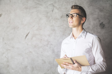 Attractive male with notepad