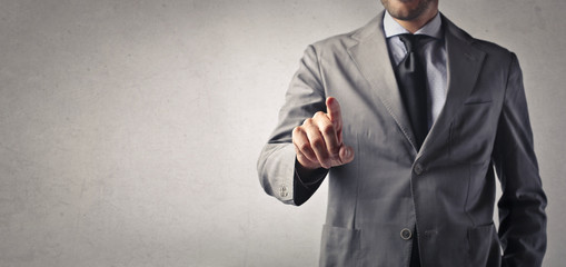 Businessman indicates with finger  © olly