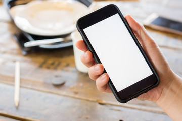 hand using cell phone with white screen