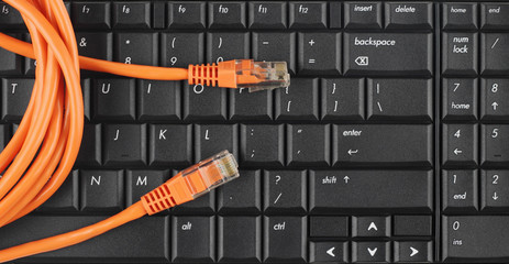 Network patch cord on a computer keyboard
