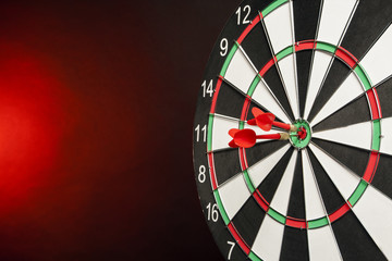 Dart in center of the target dartboard