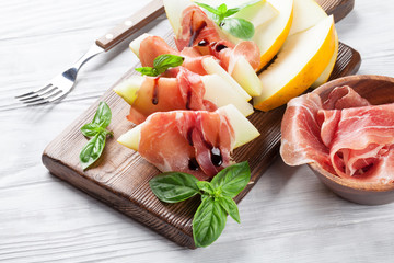 Fresh melon with prosciutto and basil