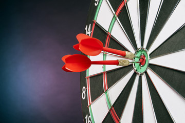 Dart in center of the target dartboard