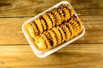 Сookies with condensed milk on the wooden table