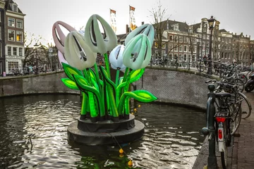 Zelfklevend Fotobehang AMSTERDAM, NETHERLANDS - JANUARY 10, 2017: Light installations on canals of Amsterdam within Light Festival. January 10, 2017 in Amsterdam - Netherland.. © Unique Vision